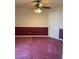 Comfortable bedroom with ceiling fan, neutral walls, and wainscoting at 6704 Lost River Ct, Las Vegas, NV 89108