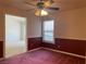 Bedroom featuring carpeted flooring, window with blinds, and ceiling fan at 6704 Lost River Ct, Las Vegas, NV 89108
