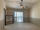 Spacious bedroom featuring ceiling fan, closet, and carpeted floor at 6704 Lost River Ct, Las Vegas, NV 89108