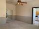 Open bedroom with attached bath, mirrored closet and fan at 6704 Lost River Ct, Las Vegas, NV 89108