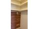 This closet has wood paneling on one wall and a built in shelf at 6704 Lost River Ct, Las Vegas, NV 89108