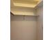 A small closet with a single built in shelf at 6704 Lost River Ct, Las Vegas, NV 89108