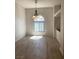 Bright dining area with elegant chandelier and a large arched window at 6704 Lost River Ct, Las Vegas, NV 89108