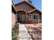 Single-story home with desert landscaping, covered front porch and charming architecture at 6704 Lost River Ct, Las Vegas, NV 89108