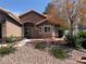 Inviting single-story home with mature trees, low-maintenance landscaping, and charming front facade at 6704 Lost River Ct, Las Vegas, NV 89108
