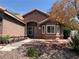 Beautiful single-story home with desert landscaping and covered front porch at 6704 Lost River Ct, Las Vegas, NV 89108