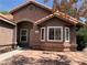 Charming single-story home with red tile roof and inviting front entrance and desert landscaping at 6704 Lost River Ct, Las Vegas, NV 89108