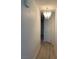 Hallway with a chandelier and laminate flooring at 6704 Lost River Ct, Las Vegas, NV 89108