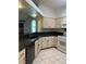 Kitchen features granite countertops, modern appliances, and tile flooring at 6704 Lost River Ct, Las Vegas, NV 89108