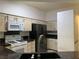 Kitchen with stone countertops, modern appliances, and bright neutral paint at 6704 Lost River Ct, Las Vegas, NV 89108