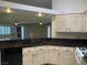 View of kitchen featuring granite countertops, stainless appliances, and custom cabinetry at 6704 Lost River Ct, Las Vegas, NV 89108
