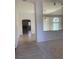Open-concept living room with archway leading to the fireplace and kitchen at 6704 Lost River Ct, Las Vegas, NV 89108