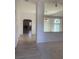 Living room featuring view of the fireplace through archway with open floor plan at 6704 Lost River Ct, Las Vegas, NV 89108