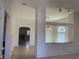 View of spacious living room with archway leading to additional living spaces and fireplace at 6704 Lost River Ct, Las Vegas, NV 89108