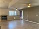 Spacious living room featuring wood flooring, neutral paint and natural lighting at 6704 Lost River Ct, Las Vegas, NV 89108