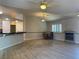 Open concept living room featuring wood flooring, breakfast bar, and dining area at 6704 Lost River Ct, Las Vegas, NV 89108