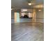 Open concept living room featuring wood flooring and breakfast bar at 6704 Lost River Ct, Las Vegas, NV 89108