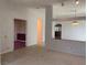 Living room featuring view of the fireplace through archway with open floor plan at 6704 Lost River Ct, Las Vegas, NV 89108