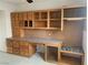 Home office space featuring built-in wooden cabinets, drawers, a desk, and carpet at 6704 Lost River Ct, Las Vegas, NV 89108