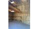 Interior view of shed showcasing insulation, wooden beams, lighting and shelves at 6704 Lost River Ct, Las Vegas, NV 89108