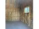 An organized shed interior shows insulation, a window, electrical outlets, and flooring at 6704 Lost River Ct, Las Vegas, NV 89108
