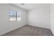 Bright bedroom with carpet, a window with scenic views, and ample natural light at 6713 Violet Cascade Ave, Las Vegas, NV 89156