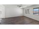 Spacious bedroom with modern floors and large windows providing plenty of natural light at 6713 Violet Cascade Ave, Las Vegas, NV 89156