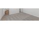 Neutral carpet and white walls create a bright and airy hallway space at 6713 Violet Cascade Ave, Las Vegas, NV 89156