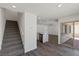 Open floor plan showcases the staircase, kitchen, and living area with sliding door at 6713 Violet Cascade Ave, Las Vegas, NV 89156