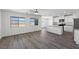 Open-concept living area with modern flooring and abundant natural light at 6713 Violet Cascade Ave, Las Vegas, NV 89156