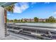 Balcony view featuring a parking area and buildings under a bright blue sky at 7100 Pirates Cove Rd # 2076, Las Vegas, NV 89145