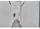 Hallway view to the bathroom with closet doors in the hall at 7100 Pirates Cove Rd # 2076, Las Vegas, NV 89145