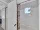 Bathroom with white tile, shower curtain, sliding glass doors, and recessed lighting at 7100 Pirates Cove Rd # 2076, Las Vegas, NV 89145