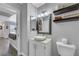 Bathroom showcasing a vessel sink, floating shelves, and modern fixtures at 7100 Pirates Cove Rd # 2076, Las Vegas, NV 89145