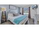 Comfortable bedroom with a plush bed, wall art, and natural light from the window at 7100 Pirates Cove Rd # 2076, Las Vegas, NV 89145