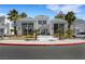 Exterior view of the community clubhouse with palm trees and manicured landscaping at 7100 Pirates Cove Rd # 2076, Las Vegas, NV 89145
