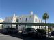 Attractive condominium building with covered parking, modern architectural details and desert landscaping at 7100 Pirates Cove Rd # 2076, Las Vegas, NV 89145