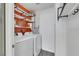 Bright laundry room featuring white washer and dryer, and plenty of overhead storage at 7100 Pirates Cove Rd # 2076, Las Vegas, NV 89145