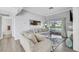 Bright living room with couch, throw pillows, and sliding glass door to a balcony at 7100 Pirates Cove Rd # 2076, Las Vegas, NV 89145