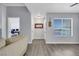 Bright living room with neutral walls and grey flooring at 7100 Pirates Cove Rd # 2076, Las Vegas, NV 89145