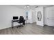 Bright room offers great natural light for an office and features a sleek black desk at 7100 Pirates Cove Rd # 2076, Las Vegas, NV 89145