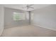 Spacious bedroom featuring neutral carpet and two windows for natural light at 7263 Pepperbox Ave, Las Vegas, NV 89179