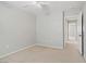 Bedroom with neutral carpet, ceiling fan, and entry door at 7263 Pepperbox Ave, Las Vegas, NV 89179