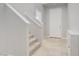 Entryway with tile flooring, stairs with carpet runner to the second level, and a white front door at 7263 Pepperbox Ave, Las Vegas, NV 89179