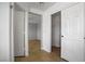 Bright hallway with multiple doors, closet space, and view into bedroom space at 7263 Pepperbox Ave, Las Vegas, NV 89179