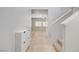 Hallway features tile floors and leads to a living area, with stairs to upper level in view at 7263 Pepperbox Ave, Las Vegas, NV 89179