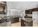 Bright kitchen with granite countertops, stainless steel appliances, and island at 7263 Pepperbox Ave, Las Vegas, NV 89179