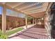 Spacious covered patio with pergola and decorative landscaping at 7263 Pepperbox Ave, Las Vegas, NV 89179