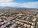 Extensive aerial view displaying community layout, showcasing neighborhood streets and home styles at 7854 Brianna Cheerful Ave, Las Vegas, NV 89178
