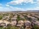 Aerial view of a desert landscape community with beautiful sky at 7854 Brianna Cheerful Ave, Las Vegas, NV 89178